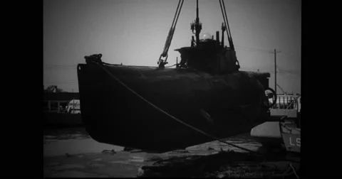 French midget submarine being lift by crane Stock Footage