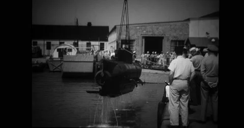 French midget submarine being lift by crane Stock Footage