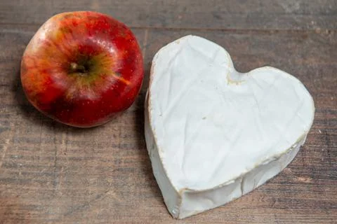 French Neufchatel cheese shaped heart with organic apple Stock Photos
