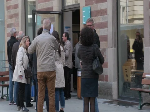 French People queue to vote in the first round of the French presidential Stock Footage 74866389