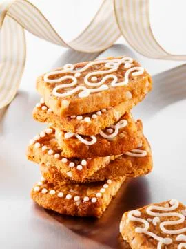 French 'pepper nut' biscuits decorated with icing sugar Stock Photos