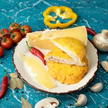 French poultry meat with cheese and pineapple. Plate with Baked or Fried chicken Stock Photos