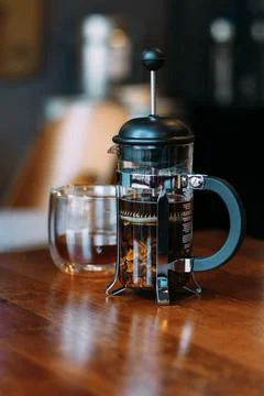 French press and glass with cascara Stock Photos