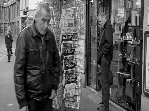 French press reporting about Bataclan Terrorist attack in Paris seniors buying Stock Footage 80624495