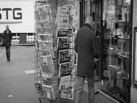 French press reporting about Bataclan Terrorist attack in Paris seniors buying Stock Footage 80624685