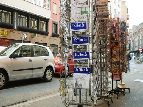 French press reporting about Bataclan Terrorist attack in Paris seniors buying Stock Footage 80624982