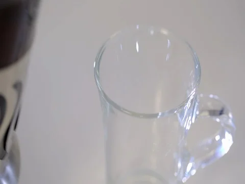 French Press with tea, tea is poured in a transparent Cup. On a white background Stock Footage 73803498
