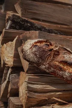 French rustic bread on a pile of logs Foto stock