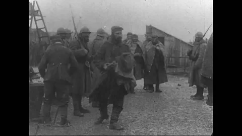 French soldiers distributing ration to German prisoners of war at camp - 1916 Vídeo Stock 83660131