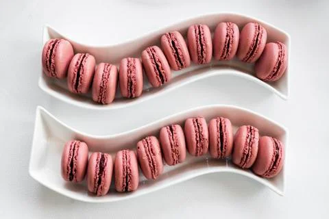 French strawberry red macaron on table Stock Photos