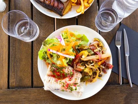 French-style molva or sea pike with vegetables. French cuisine Stock-Fotos