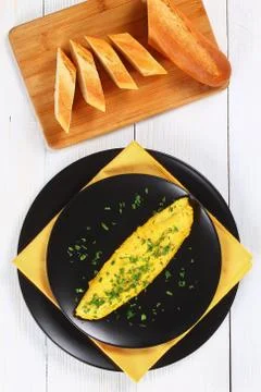French three eggs fluffy omelette, top view Stock Photos