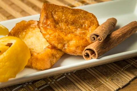 French toast in a rectangular dish on a bamboo mat Stock Photos