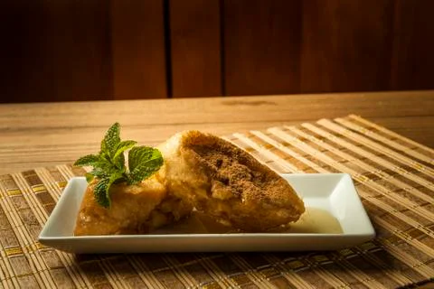 French toast in a rectangular dish on a bamboo mat Stock Photos