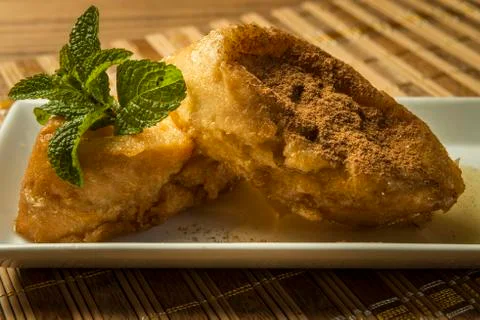 French toast in a rectangular dish on a bamboo mat Stock Photos