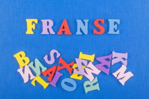 FRENCH word on blue background composed from colorful abc alphabet block wo.. Stock Photos