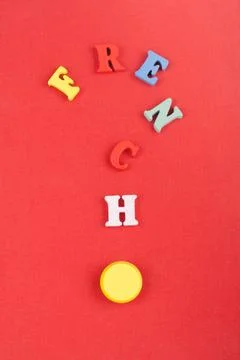 FRENCH word on red background composed from colorful abc alphabet block woo.. Stock-Fotos
