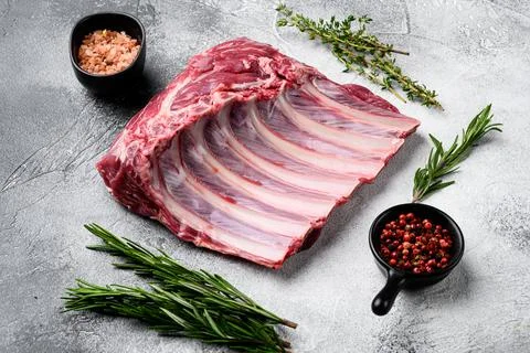 Frenched rack of lamb Mutton, on gray stone table background Stock Photos