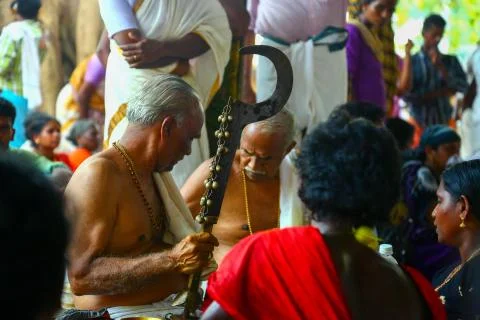 A frenzied mob of devotees led by oracles walk around the temple Stock Photos