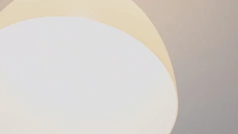 Frequent switching on and off of a light bulb in a white ceiling lamp. with.. Stock Footage 303805614