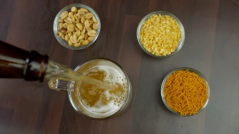 Frequent topping up of chilled beer in a transparent mug - a refreshing drink Stock-Footage 162017646