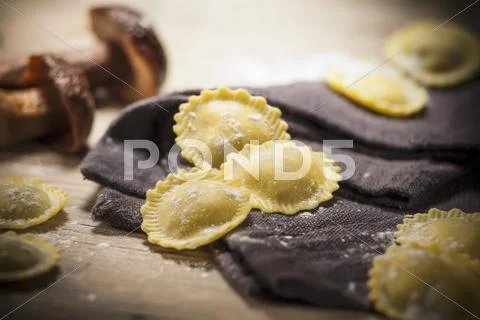 Fresh agnolotti filled with mushrooms Stock Photos