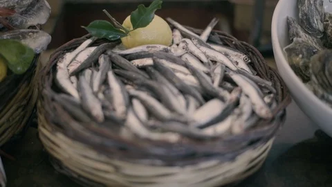 Fresh Anchovy basket with lemon Stock Footage 86076264