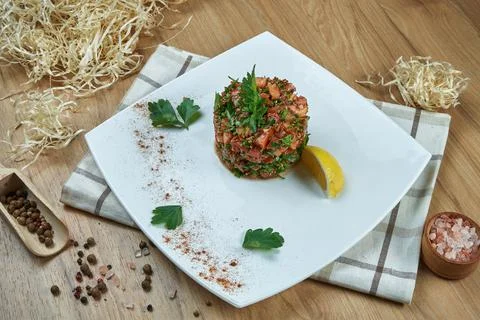 Fresh and appetizing vegetarian salad with tomato salsa, herbs, olive oil and Stock Photos