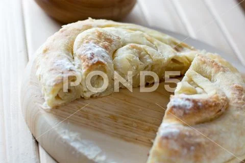 Fresh And Delicious Cheese Pie Cut On The Wooden Plate