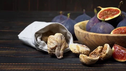 Fresh and dried Fig isolated on wooden background Stock Footage 83727417