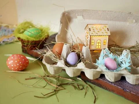 Fresh and Easter painted chicken and quail eggs in a packing tray Stock Photos