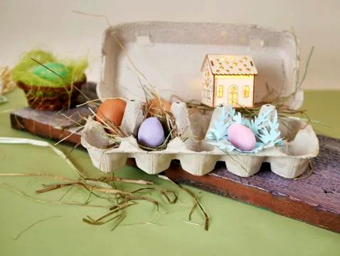Fresh and Easter painted chicken and quail eggs in a packing tray Stock Photos