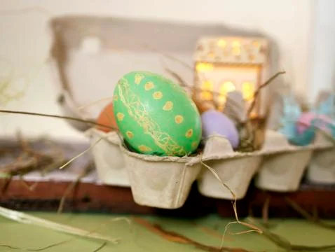 Fresh and Easter painted chicken and quail eggs in a packing tray Stock Photos