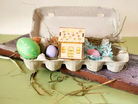 Fresh and Easter painted chicken and quail eggs in a packing tray Stock Photos