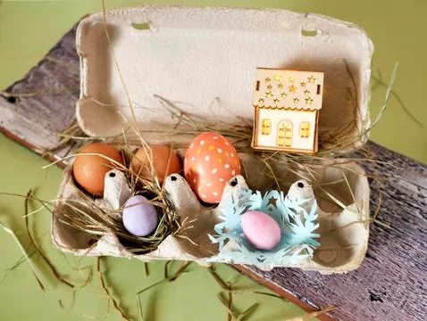 Fresh and Easter painted chicken and quail eggs in a packing tray Stock Photos