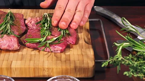 Fresh and raw veal meat. Steaks with seasonings in a row ready to cook. Stock Footage 66449341