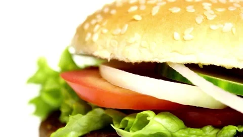 Fresh appetizing hamburger rotating on white background. lettuce, onion pickled Stock Footage 336578697