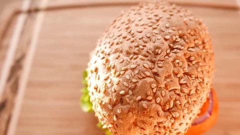 Fresh appetizing hamburger with a salad and tomato Stock Footage 74168920