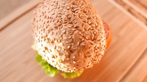 Fresh appetizing hamburger with a salad and tomato Stock Footage 74169014