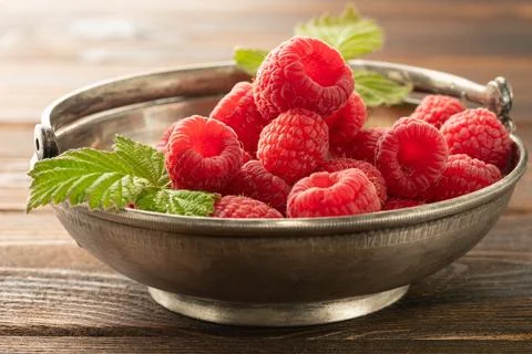 Fresh appetizing raspberries Stock Photos