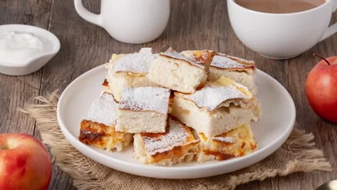 Fresh Apple Cake with Coffee and Cream Set on Rustic Table Stock Footage 346703637