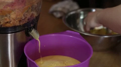 Fresh apple juice extracted with squeezer Stock Footage 50254186