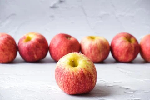 Fresh Apple lining up with white background 写真素材