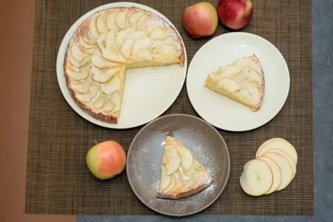 Fresh apple pie cut into triangular pieces. View from above Stock Photos