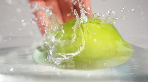 Fresh apple throwing into water Stock Footage 62911293