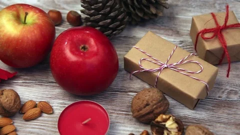 Fresh apples, nuts and gift box Vídeo Stock 71641178