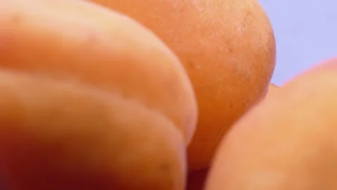 Fresh apricots rotating in deep plate on white background 库存影片 342982763