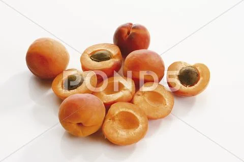 Fresh apricots, whole and halved Stock Photos