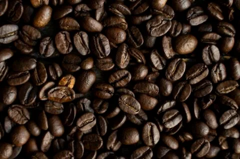 Fresh arabica coffee beans as a texture or background. Stock Photos