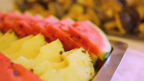 Fresh Arbush Fruit And Pineapple On A Plate Stock Footage 304873799